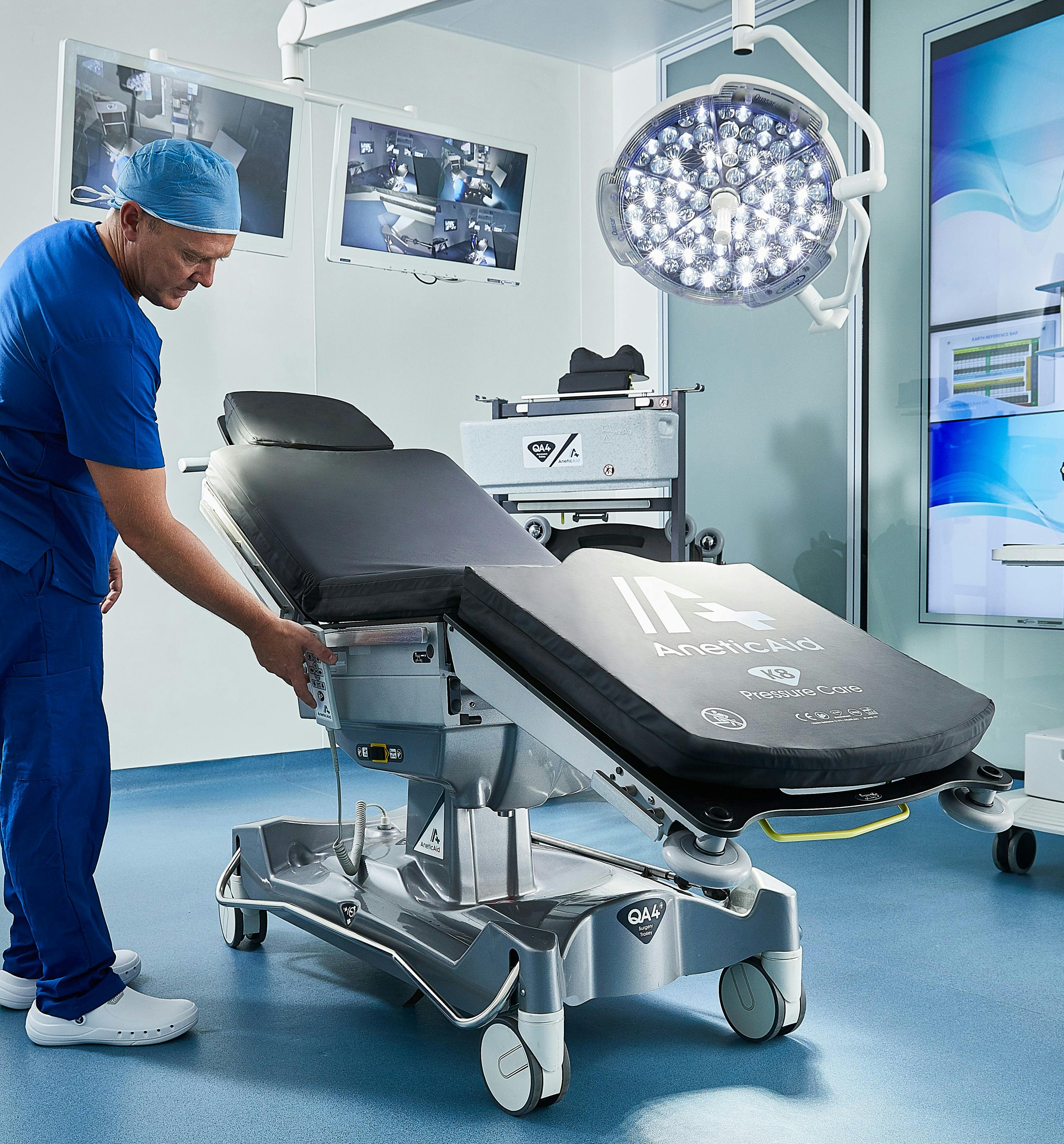 Man in operating theatre with QA4 trolley